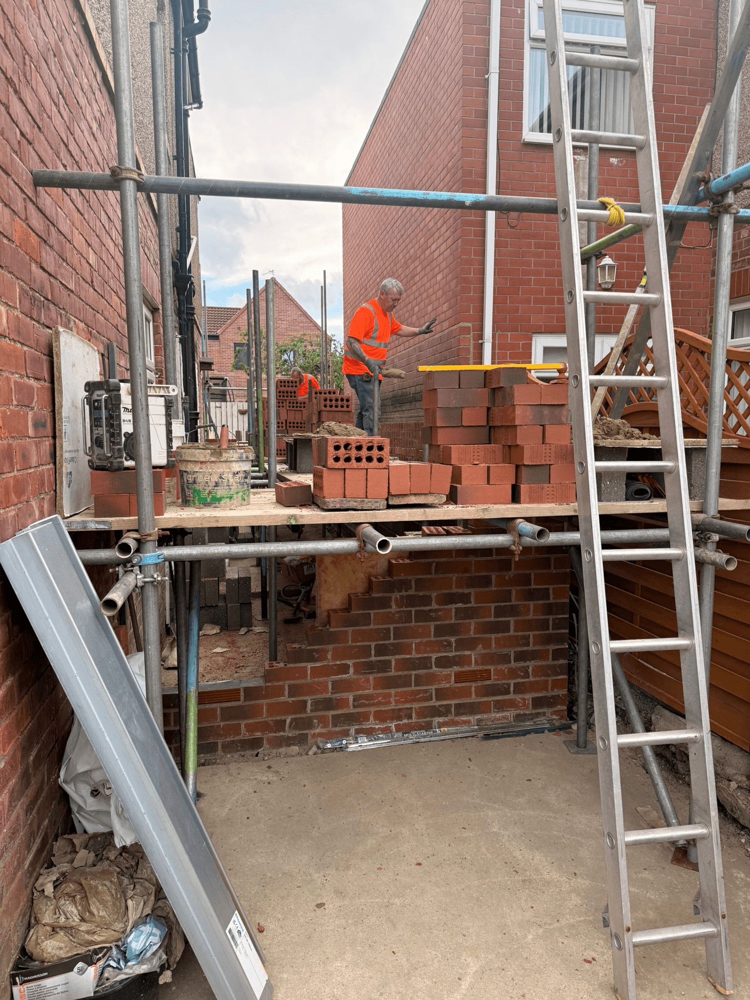 Scaffolding and brickwork on site — Essential Home Improvement